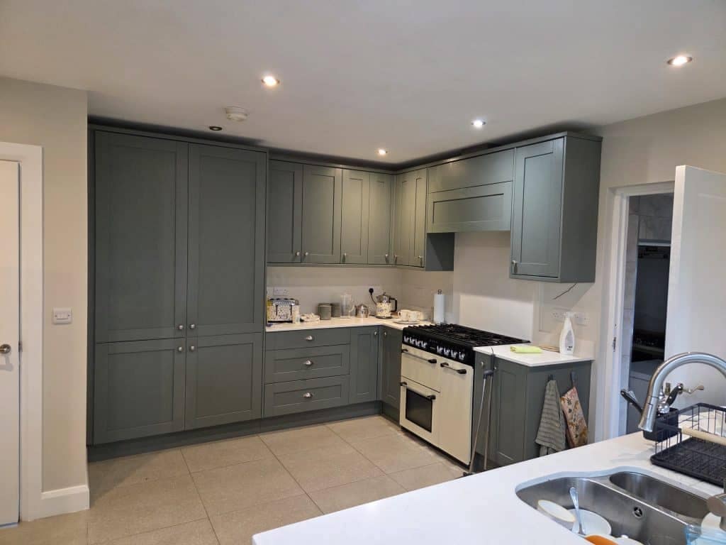 Vivid green kitchen cabinets painted by G&E Interior Painting in Portstewart for a modern interior renovation. Skilled professional painters transform kitchens with expert cabinet painting services in Northern Ireland.