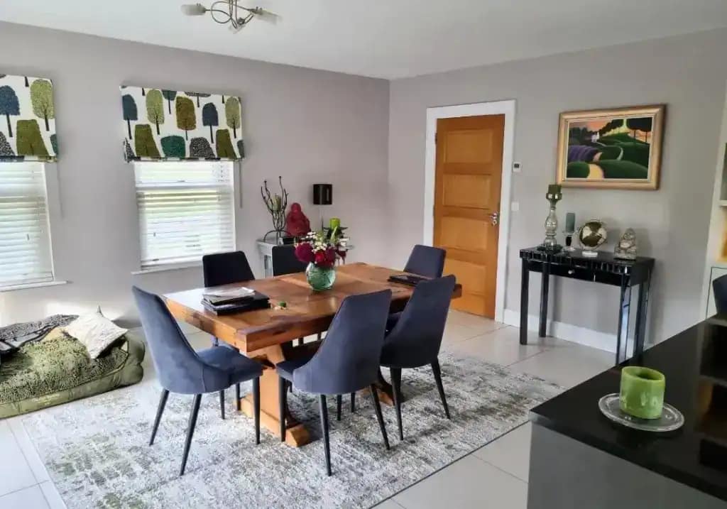 Vibrant interior dining room with modern decor, featuring painted walls, stylish furniture, and decorative accents, showcasing professional interior painting services in Portstewart.