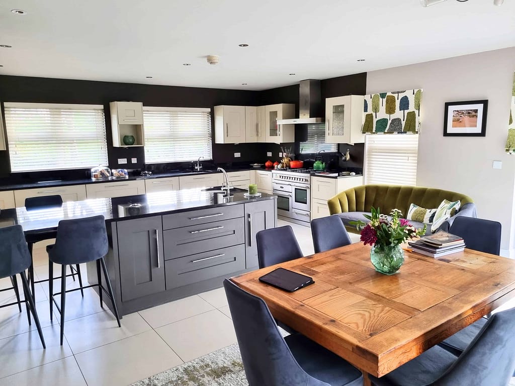 Modern kitchen with dining table and island