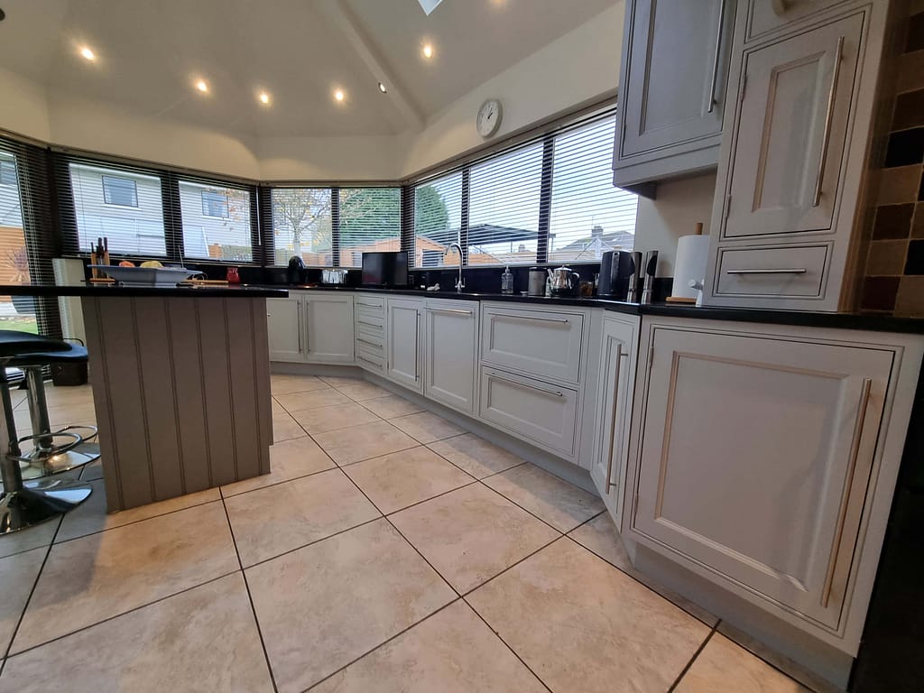 Gray hand painted kitchen cupboards in castlerock