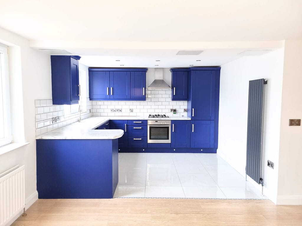 Modern kitchen with blue cabinets and appliances