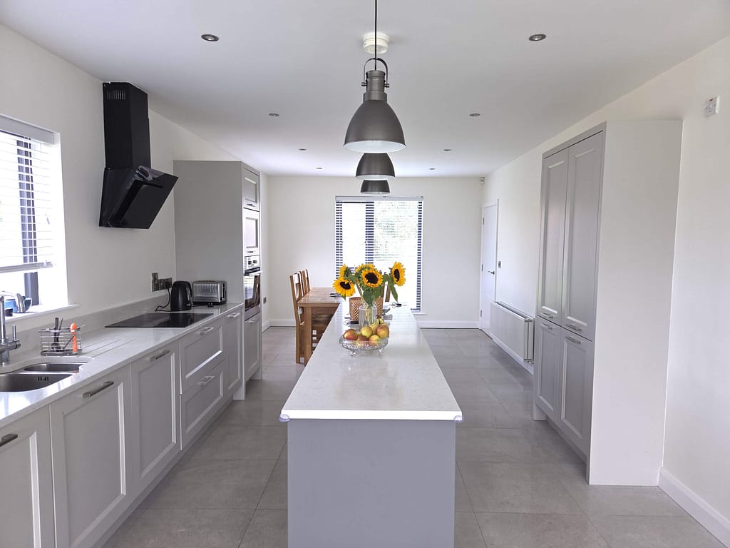 Gray interior kitchen painted by expert painters in coleraineshowcasing modern cabinetry, sleek countertops, and fresh wall finishes for a clean, contemporary look.